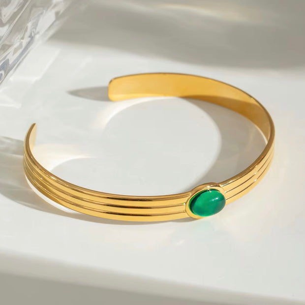 This beautiful, luxurious Green Agate Bangle Bracelet not only adds a touch of elegance to any outfit, but it also has potential benefits. Green agate is believed to improve decision-making, mental clarity, and emotional balance, making this a fashionable and beneficial addition to your jewelry collection!

316L Stainless Steel 18K PVD Gold Plated

Adjustable

Non Tarnish, Hypoallergenic and water resistant.