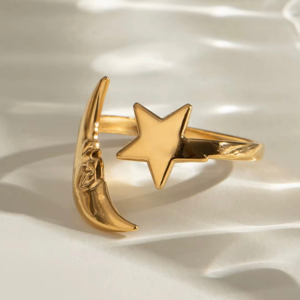 This Moon &amp; Star Open Ring combines a mystical and trendy design that is both cute and water resistant. Made from high-quality materials, this ring is perfect for any occasion and brings a touch of magic to any outfit. Add this unique piece to your collection and stand out with its enchanting charm.

Fit Size 7-8 , adjustable&nbsp;

18k Gold over Stainless Steel - Made to last!

Hypoallergenic, Tarnish free Shower &amp; Beach Friendly