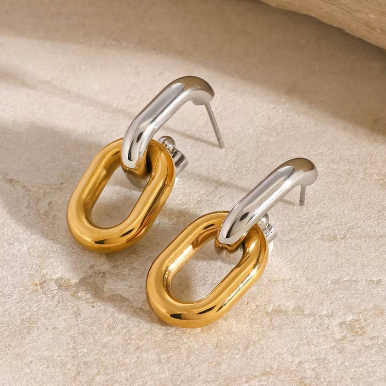 Introducing Erina Two Tone Chain Hoop Earrings - a must-have for any collection. These elegant earrings feature a trendy two-tone design and are sure to elevate any outfit. A staple for every fashion-forward individual.

Made to last!&nbsp;Tarnish and Water Resistant, Beach & Shower friendly, Hypoallergenic




18K Gold Plated over 316L Stainless Steel base