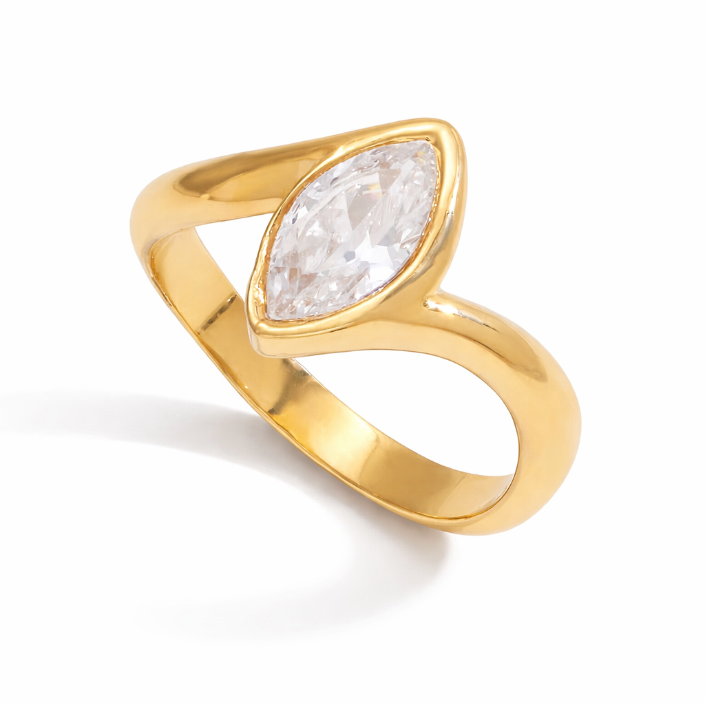 Darya Ring in polished gold stainless steel featuring a marquise-cut clear stone on a white background