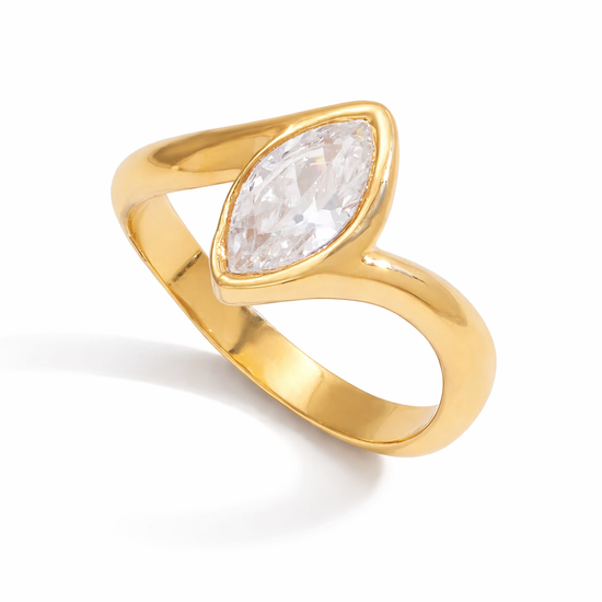 Darya Ring in polished gold stainless steel featuring a marquise-cut clear stone on a white background