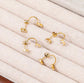 Back view of pear ear jacket earrings showing curved behind-ear design and double stud structure