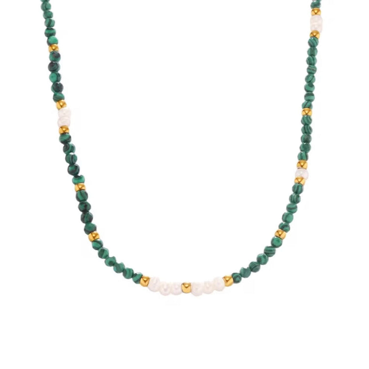 Malachite and freshwater pearl necklace with green beads and gold accents on white background