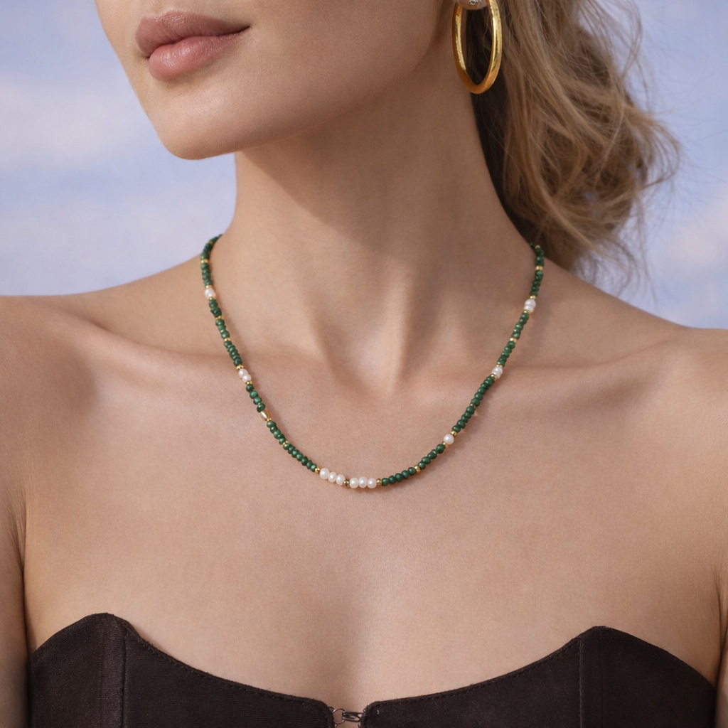 Malachite and pearl necklace worn on model, 16 inch length sitting at collarbone